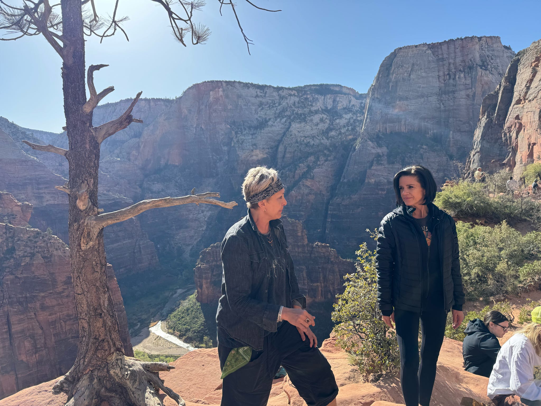 Two guests overlooking a Zion canyon during a 21-day mental health retreat at The Bridge Health Recovery Center